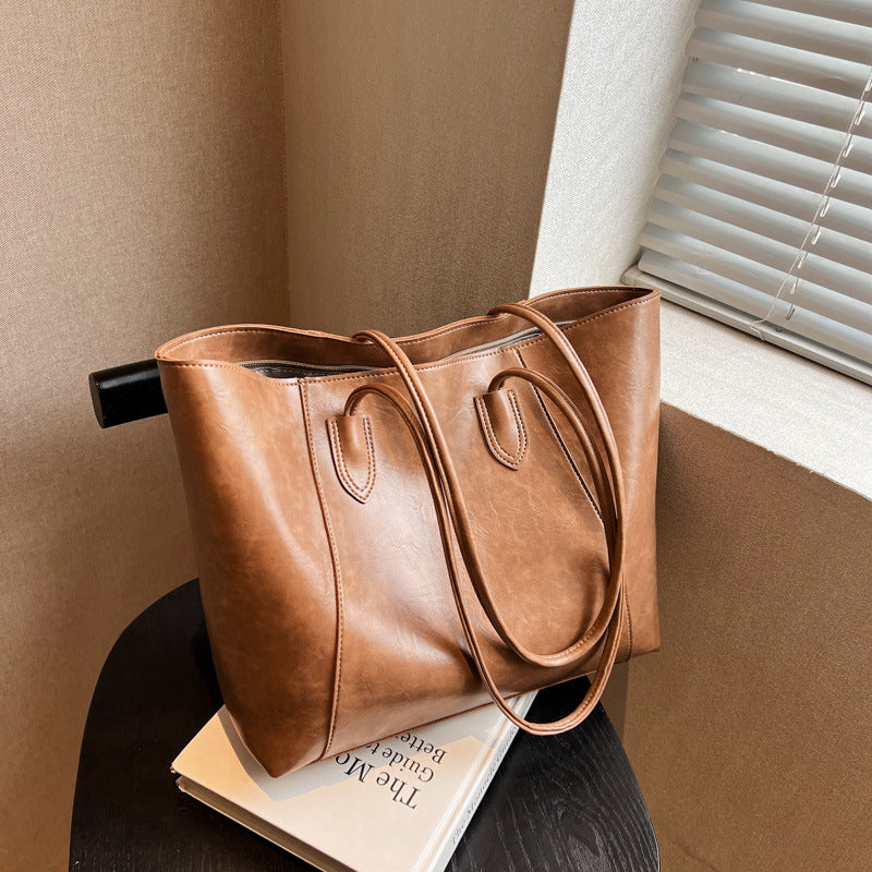 Bag niche design fashion shoulder bag female oil wax leather shiny glossy sense of tote bag PU simple commuter bag female