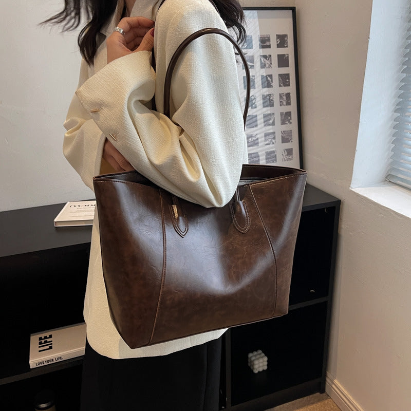 Bag niche design fashion shoulder bag female oil wax leather shiny glossy sense of tote bag PU simple commuter bag female