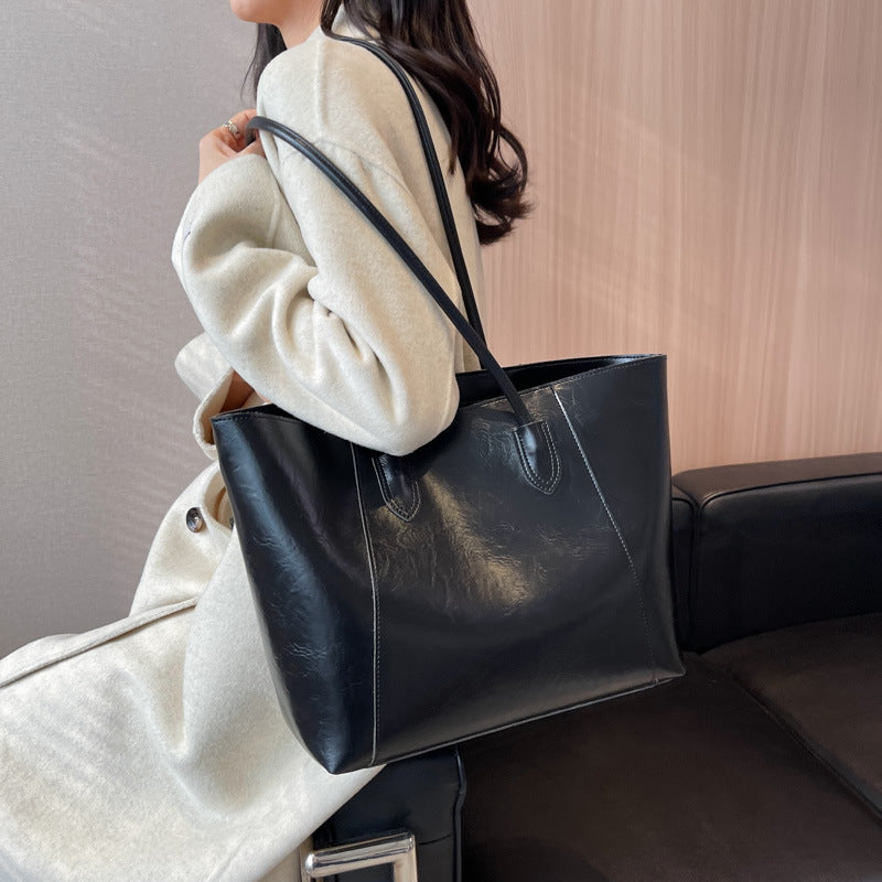 Bag niche design fashion shoulder bag female oil wax leather shiny glossy sense of tote bag PU simple commuter bag female